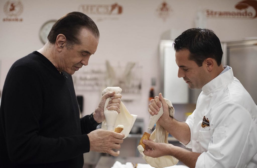 A Bronx Tale creator Chazz Palminteri pipes a cannoli at Villa Italia with owner Bobby Mallozzi Monday, September 24, 2018.
