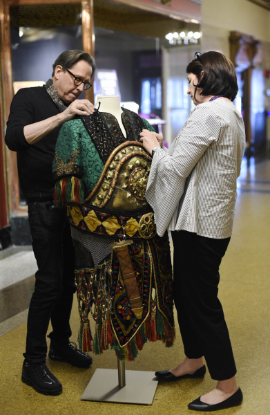 Creative director RIchard Lovrich and audience devcelopment and retention specialist Heather West assemble a window display showing past costumes from The Phantom of the Opera at Proctors Tuesday, April 23, 2019.