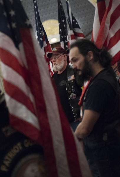 Members of the Patriot Guard Riders hold flags before the dedication of a POW/MIA Chair of Honor in Schenectady Tuesday, November 6, 2018. The chair, placed in the balcony of the theatre, will remain empty to honor American service members and recognize their sacrifice.